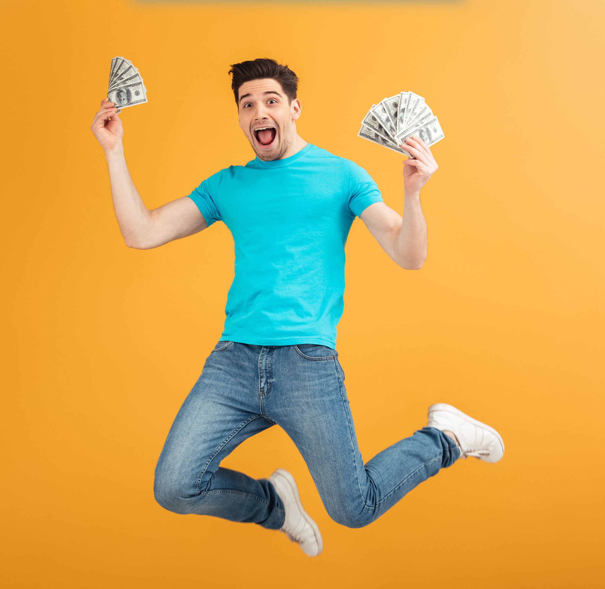 Portrait,Of,A,Joyful,Young,Man,In,T-shirt,Holding,Bunch
