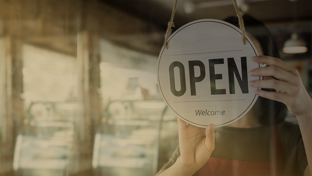 Small business with open sign on door
