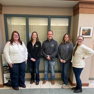 Employees wearing NCCYou logo clothing