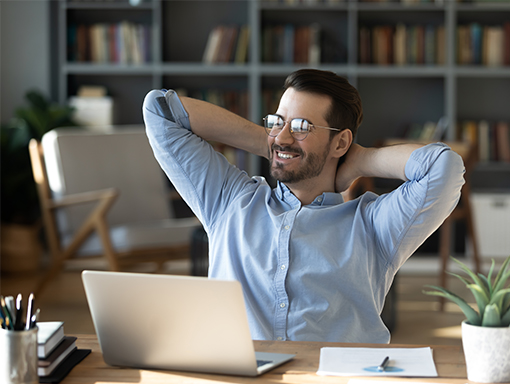 Online bill pay from NCCYou Man looking relaxed in front of his laptop