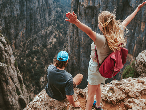 Person-loans-NCCYou A young couple on a dream vacation hiking in the mountains.