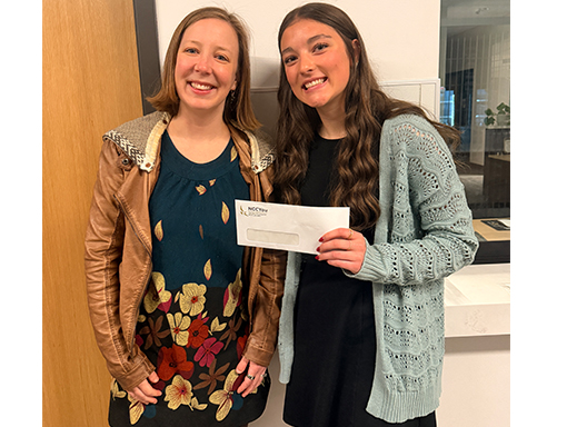 NCCYou's Maria Corradi Haines presenting 2026 scholarship check to Brynn Rozinka